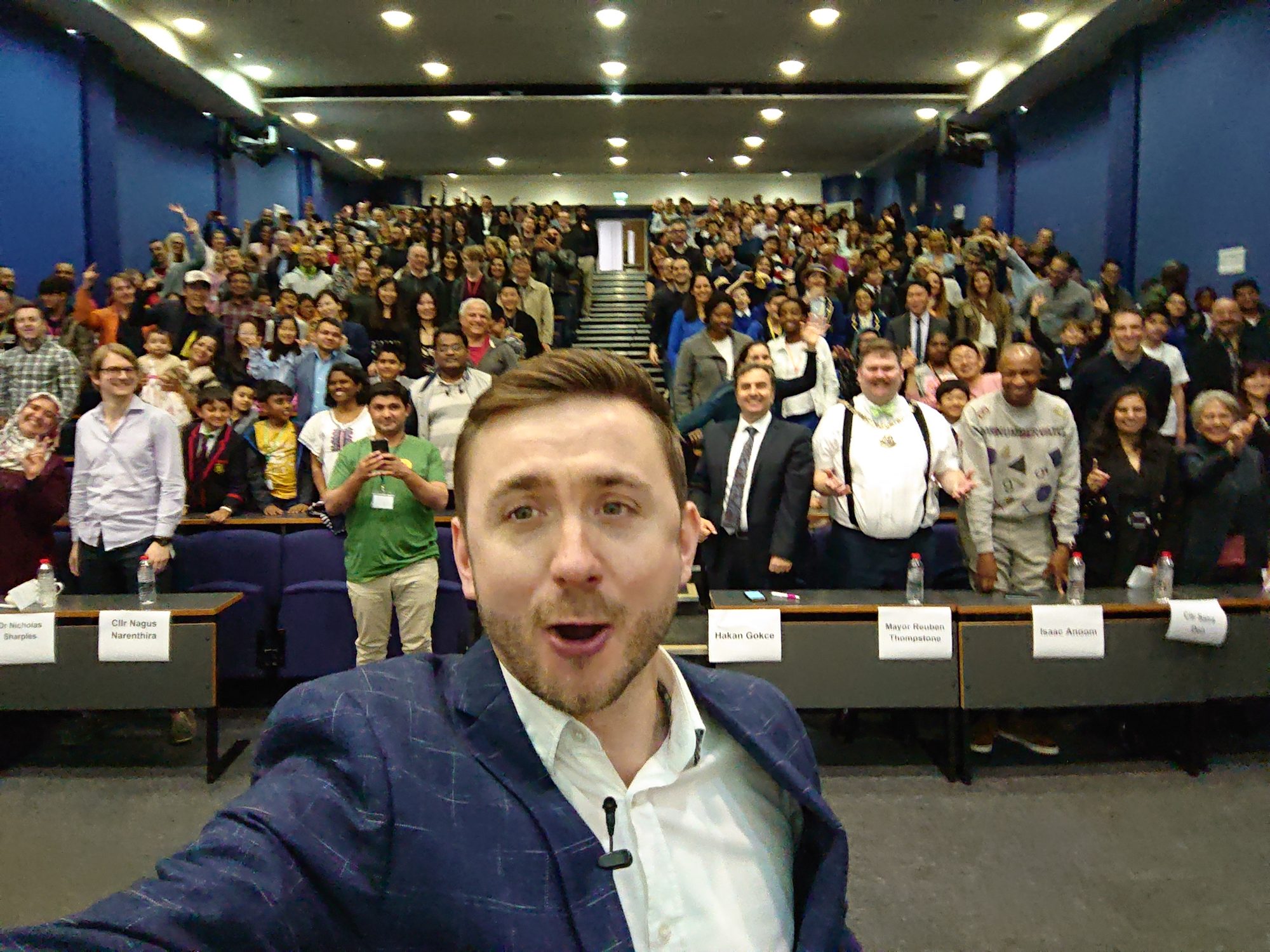 A full lecture theatre of delegates at a conference