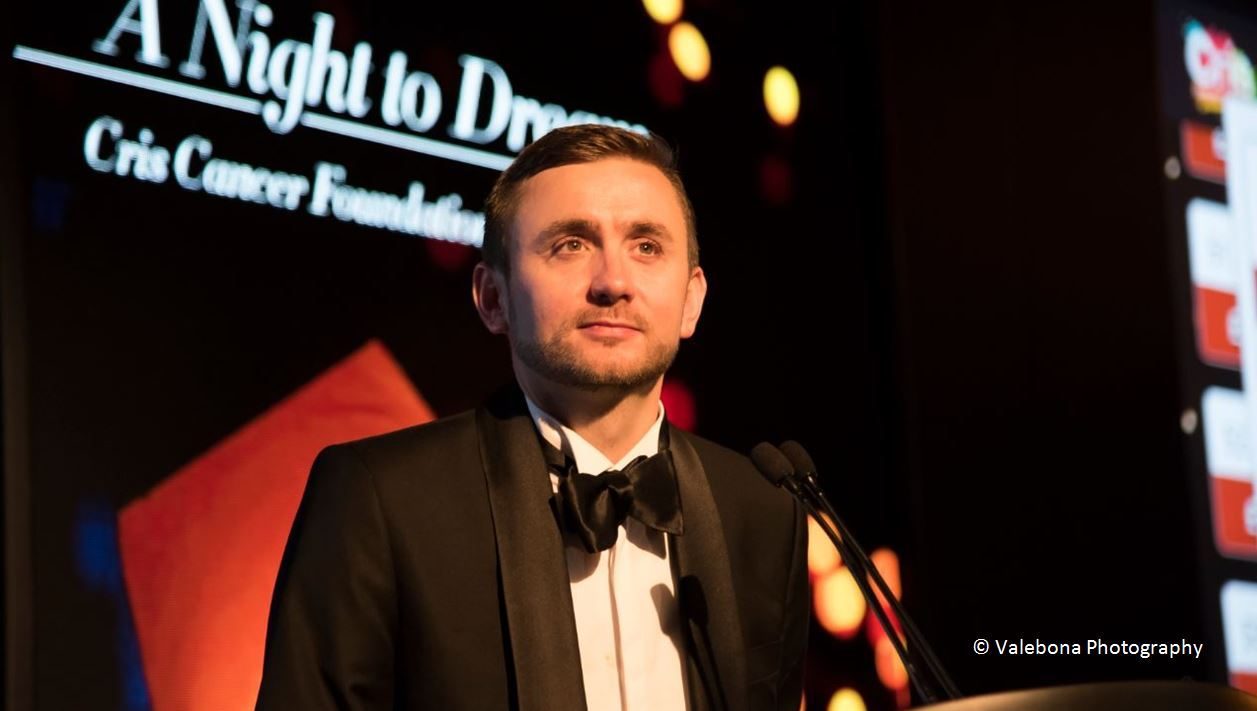 Kevin Durham on stage at a corporate event