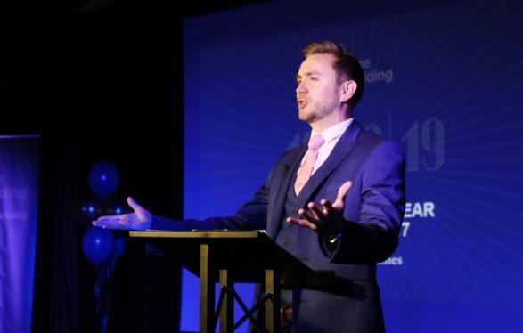 Kevin Durham on stage at a conference
