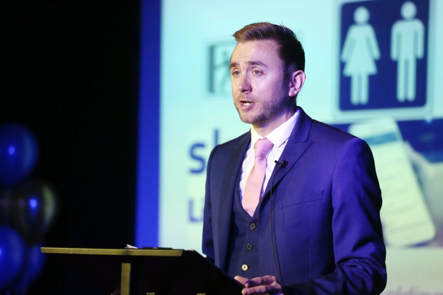 Kevin Durham chairing a staff conference from the stage