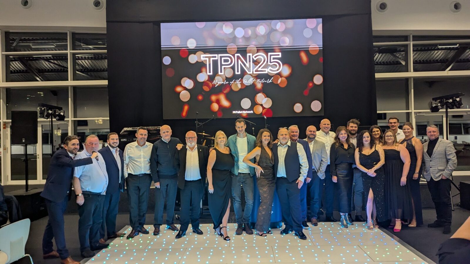 Kevin Durham with the whole team on stage at the TPN 25 conference