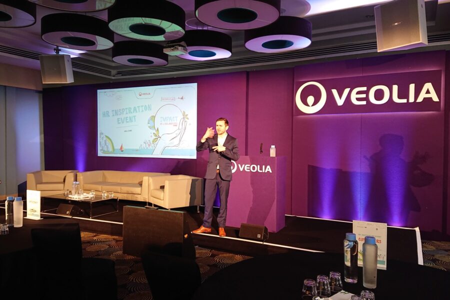 Kevin Durham hosting the Veolia conference from a wide stage